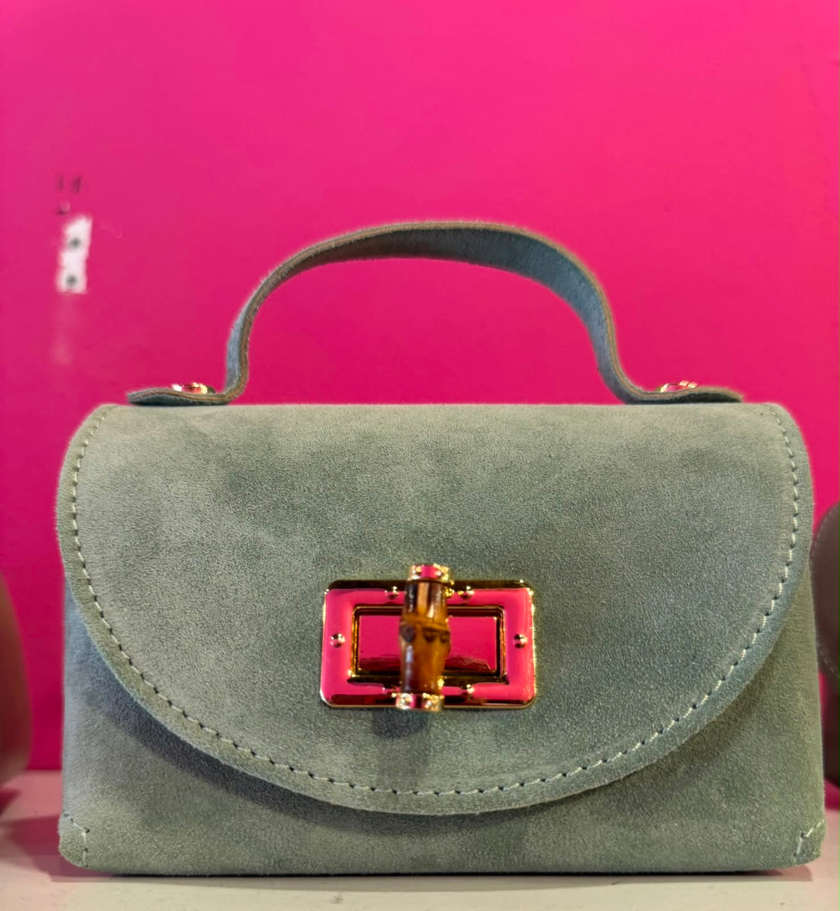 Borsa Eddy in vera pelle con tracolla metallica e inserto bambù hardware dorato